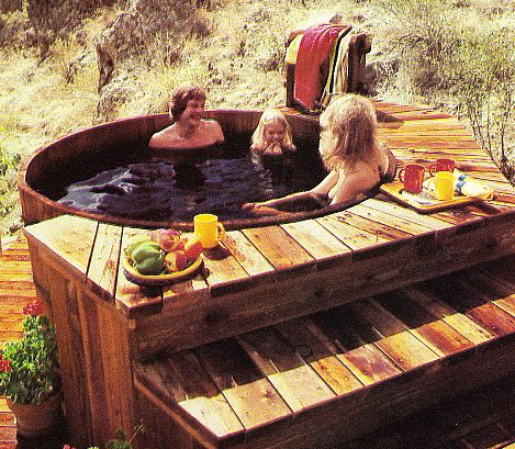 Family sitting in hot tub.