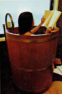 Woman reading in hot tub built for one.
