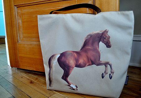 A tote bag with a horse on it.