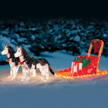 Light up huskies pulling a sleigh.
