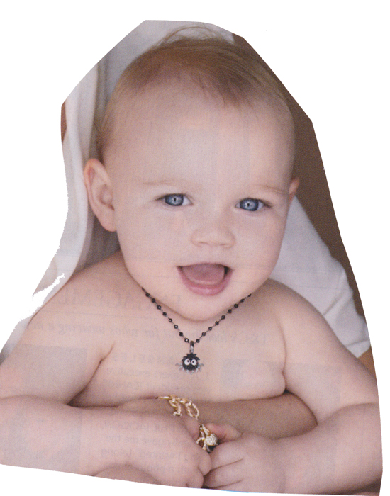 baby wearing a creepy necklace