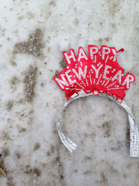 happy new year tiara on street in dirty snow